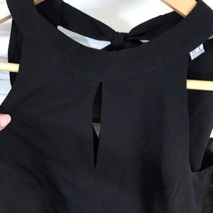 Black, cropped, halter Jumpsuit.